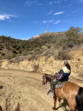 The Hollywood Sign and our guide ‘G’ during our horseback ride with Sunset Ranch. CYNTHIA MCLEOD/TORONTO SUN