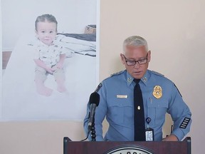 FLE - Chatham County, Ga., Police Chief Jeff Hadley speaks to reporters as he stands in front of a large photo of missing toddler Quinton Simon at a police operations center being used in the search for the boy's remains just outside Savannah, Ga., on Oct. 18, 2022. Leilani Simon, the mother of the toddler found dead in a Georgia landfill, was charged Wednesday, Dec. 14, with murder and other crimes in a 19-count indictment that alleges she used drugs before killing her son and dumping his body in a trash bin. (WSAV-TV via AP, File)