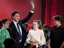 Prime Minister Justin Trudeau is joined on stage by wife Sophie Grégoire Trudeau, left, and children Ella-Grace and Xavier, right, following his victory speech at Party campaign headquarters in Montreal, early Tuesday, Sept. 21, 2021. Trudeau is heading to Jamaica after Christmas for a one-week vacation with his immediate family.