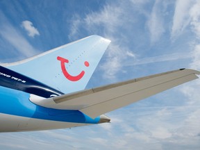 Picture taken on June 12, 2013 shows a Boeing 787 "Dreamliner" plane of Thomson Airways with the logo of tourism giant TUI at the Hanover airport in Langenhagen, central Germany.