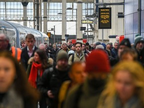 Commuters arriving on one of the limited services at London Waterloo station on Dec. 13.