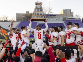 Kevin Mital of Laval hoists the Vanier Cup after Laval won the Vanier Cup in London, Ont. , on Nov. 26, 2022. Western's home stadium has the potential to host a CFL game some day.