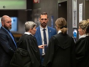 SQ lead investigator Guillaume Poirier, centre amid the prosecution team, testified about how Sandra and James Helm were allegedly kidnapped from their home in the state of New York on Sept. 27, 2020, at the trial of Gary Arnold at the Palais de Justice in Montreal on Thursday, Jan. 12, 2023.