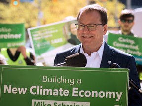 Ontario Green Party Leader Mike Schreiner smiles as supporters clap during a press conference at Bloor-Bedford Parkette in Toronto as part of his campaign tour, on Tuesday, May 17, 2022.