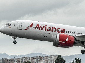 In this file photo taken on Aug. 28, 2019, an aircraft of Colombian company Avianca lands at El Dorado International Airport in Bogota.