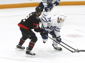 Toronto Maple Leafs centre Bobby McMann (74) and Ottawa Senators defenceman Artem Zub (2) battle for the puck during pre-season action.