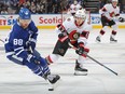 Tyler Ennis of the Ottawa Senators skates to check William Nylander of the Toronto Maple Leafs during an NHL game at Scotiabank Arena on October 16, 2021 in Toronto, Ontario, Canada.