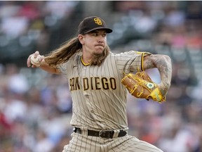 Mike Clevinger of the San Diego Padres delivers a pitch against the Detroit Tigers during the bottom of the first inning at Comerica Park on July 26, 2022 in Detroit, Michigan.