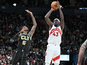 Toronto Raptors forward Pascal Siakam shoots the ball as Charlotte Hornets forward Jalen McDaniels defends.