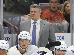 Sheldon Keefe behind the bench of the Maple Leafs against the Coyotes at Mullett Arena in Tempe, Ariz., Dec. 29, 2022.