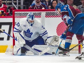 Matt Murray of the Toronto Maple Leafs blocks a shot by J.T. Compher of the Colorado Avalanche during the first period at Ball Arena on December 31, 2022 in Denver, Colorado.