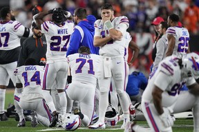 Josh Allen #17 of the Buffalo Bills reacts after teammate Damar Hamlin #3 collapsed following a tackle against the Cincinnati Bengals during the first quarter at Paycor Stadium on January 02, 2023 in Cincinnati, Ohio. (Photo by Dylan Buell/Getty Images)