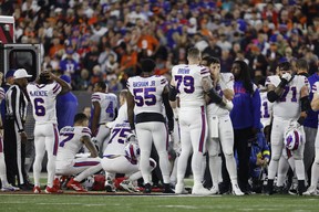 Buffalo Bills players react after teammate Damar Hamlin #3 was injured against the Cincinnati Bengals during the first quarter at Paycor Stadium on January 02, 2023 in Cincinnati, Ohio. (Photo by Kirk Irwin/Getty Images)