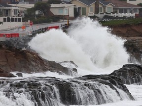 Pacific Ocean waves break near homes on Jan. 11, 2023 in Santa Cruz, California. The San Francisco Bay Area and much of Northern California continues to get drenched by powerful atmospheric river events that have brought high winds and flooding rains.