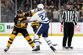 Nick Foligno #17 of the Boston Bruins and Wayne Simmonds  of the Toronto Maple Leafs fight during the first period at TD Garden on January 14, 2023 in Boston, Massachusetts. Maddie Meyer/Getty Images