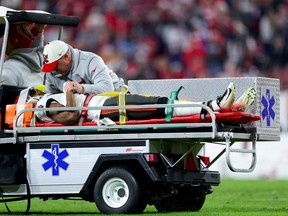 Russell Gage of the Tampa Bay Buccaneers is carted off the field after suffering an injury against the Dallas Cowboys during the fourth quarter in the NFC Wild Card playoff game at Raymond James Stadium on January 16, 2023 in Tampa, Florida.