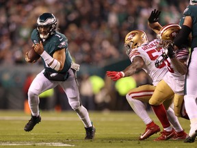 Eagles' Jalen Hurts runs the ball against Dre Greenlaw of the San Francisco 49ers during the third quarter in the NFC Championship Game at Lincoln Financial Field on Jan. 29, 2023 in Philadelphia.