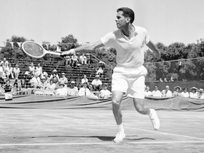 Dick Savitt hits a shot during his Davis Cup tennis match against Fumiteru Nakano of Japan, in Louisville, on, July 20, 1951.