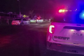 In this image released by Tulare County Sheriff’s Office, detectives investigate a shooting in Goshen near Visalia, Calif., early morning Monday, Jan. 16, 2023.