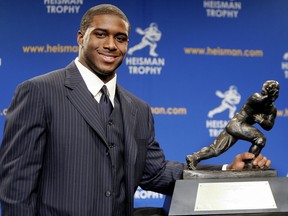 Running back Reggie Bush #5 of the USC Trojans poses with the 2005 Heisman trophy after winning the award at the 71st Annual Heisman Ceremony on December 10, 2005 in New York City.