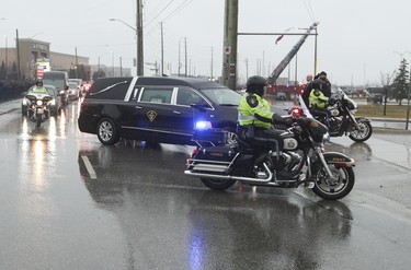 The hearse carrying the body of slain OPP Const. Grzegorz Pierzchala arrives at the Sadlon Arena on Bayview Dr.  in Barrie. on Wednesday January 4, 2023. Jack Boland/Toronto Sun/Postmedia Network