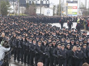 A large contingent of officers from across the province, Canada and U.S. participate in the funeral procession for slain OPP Const. Grzegorz Pierzchala in Barrie on Wednesday, January 4, 2023. Jack Boland/Toronto Sun
