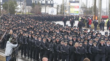 A large contingent of officers from across the province, Canada and U.S. were in attendance at the funeral procession for slain OPP Const. Grzegorz Pierzchala, held in Barrie. The funeral took place at the Sadlon Arena on Bayview Dr.  on Wednesday January 4, 2023. Jack Boland/Toronto Sun/Postmedia Network