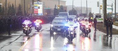 The hearse carrying the body of slain OPP Const. Grzegorz Pierzchala arrives at the Sadlon Arena on Bayview Dr.  in Barrie. on Wednesday January 4, 2023. Jack Boland/Toronto Sun/Postmedia Network