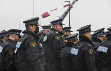 A large contingent of OPP officers file into the Sadlon Arena on Bayview Dr., in Barrie, during the funeral procession for slain OPP Const. Grzegorz Pierzchala.   on Wednesday January 4, 2023. Jack Boland/Toronto Sun/Postmedia Network