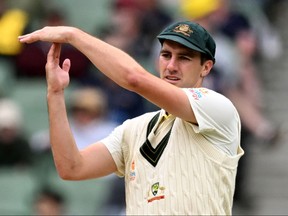 Australia's captain Pat Cummins signals for an umpire's review on the fourth day of the second cricket Test match between Australia and South Africa at the MCG in Melbourne on December 29, 2022.