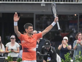 Serbian tennis player Novak Djokovic celebrates after winning his first round match against France's Constant Lestienne at the ATP Adelaide International tournament in Adelaide on January 3, 2023.