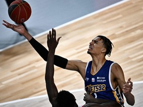 Metropolitans 92 French power forward Victor Wembanyama fights for the ball during the French Elite basketball match between JDA Dijon and Boulogne-Levallois Metropolitans 92 at the Palais des Sports Jean-Michel-Geoffroy in Dijon, on January 15, 2023. (JEFF PACHOUD/AFP via Getty Images)