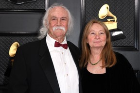 In this file photo taken on January 26, 2020, David Crosby (L) and wife Jan Dance arrive for the 62nd Annual Grammy Awards in Los Angeles. (Photo by VALERIE MACON/AFP via Getty Images)