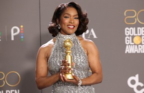 Angela Bassett poses with her award for Best Supporting Actress in a Motion Picture for “Black Panther: Wakanda Forever.” MARIO ANZUONI/REUTERS