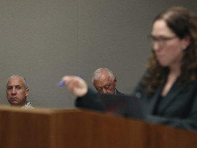 Albert "Ian" Schweitzer, left, looks on as Innocence Project attorney Susan Freidman speaks during Schweitzer's court case Tuesday, Jan. 24, 2023, in Hilo, Hawaii.