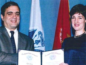 An undated handout image from a U.S. Department of Defense report dating back to 2005 shows Ana Belen Montes receiving a national intelligence certificate of distinction from George Tenet, who served as Director of Central Intelligence for the United States Central Intelligence Agency.