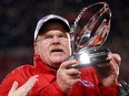 Head coach Andy Reid of the Kansas City Chiefs holds up the Lamar Hunt Trophy after defeating the Cincinnati Bengals 23-20 in the AFC Championship Game at GEHA Field at Arrowhead Stadium on Jan. 29, 2023 in Kansas City, Miss.