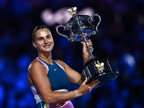 Belarus' Aryna Sabalenka celebrates with the Daphne Akhurst Memorial Cup after defeating Kazakhstan's Elena Rybakina in the women's singles final match on day thirteen of the Australian Open tennis tournament in Melbourne on Jan. 28, 2023.