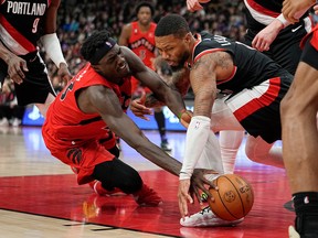 Raptors' Pascal Siakam (left) goes for the ball against Portland Trail Blazers' Gary Payton II during the first half at Scotiabank Arena on Sunday, Jan. 8, 2023.