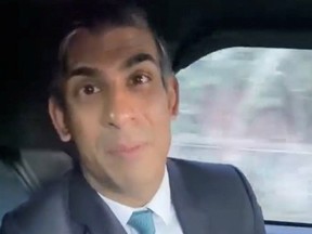 British Prime Minister Rishi Sunak appears to not be wearing his seat belt in this screen grab taken from a social media video on January 19, 2023.