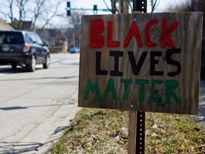 A Black Lives Matter sign is seen near the corner of Emerson Street and Dodge Avenue in Evanston, Ill., March 19, 2021.