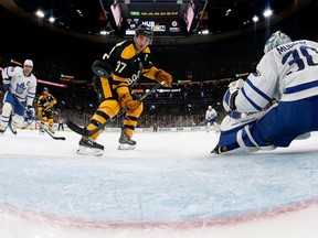 Boston Bruins centre Patrice Bergeron scores on Maple Leafs goaltender Matt Murray during the first period at TD Garden on Saturday night.-