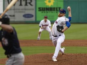 Pitcher Brady Feigl throws during a double-A baseball game against the San Antonio Missions on May 11, 2021, in Midland, Texas. He's one of two minor league pitchers with the same name and appearance.
