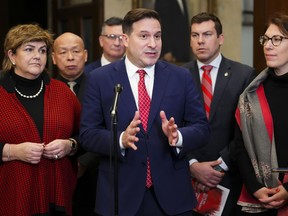 Minister of Public Safety Marco Mendicino speaks to reporters in the foyer of the House of Commons on Parliament Hill in Ottawa on Wednesday, Dec. 14, 2022, regarding Bill C-21.