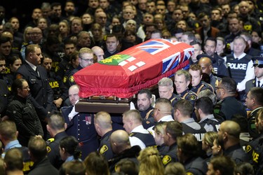 Pallbearers carry the casket of OPP Const. Grzegorz (Greg) Pierzchala during his funeral service in Barrie, Ont., Wednesday, Jan.4, 2023. THE CANADIAN PRESS/Frank Gunn