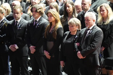 The parents (right) and family members of OPP Const. Grzegorz (Greg) Pierzchala attend his funeral service in Barrie, Ont., Wednesday, Jan.4, 2023. THE CANADIAN PRESS/Frank Gunn