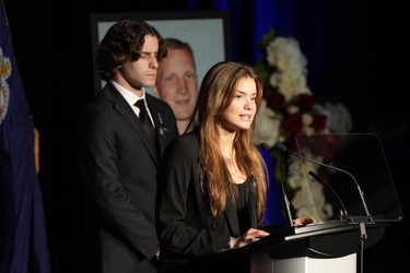Justyna Pierzchala, sister of OPP Const. Grzegorz (Greg) Pierzchala, speaks during his funeral service in Barrie, Ont., Wednesday, Jan.4, 2023 as her brother Michal Pierzchala looks on. THE CANADIAN PRESS/Frank Gunn
