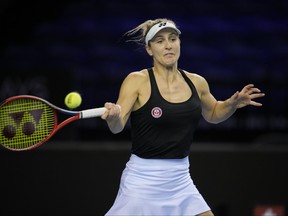 Canada's Gabriela Dabrowski plays as return during a doubles match with playing partner Canada's Leylah Fernandez against Switzerland's Simona Waltert and Jil Teichmann on the 4th day of the Billie Jean King Cup tennis finals at the Emirates Arena in Glasgow, Scotland Friday, Nov. 11, 2022.
