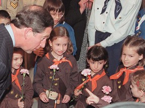 Prince Charles stops to chat with a group of Brownies upon his arrival in Ottawa in 1996. The Brownies will soon be referred to as Embers.