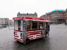 A sausage stand is seen next to the city hall in Copenhagen, Denmark on Jan.18, 2021.